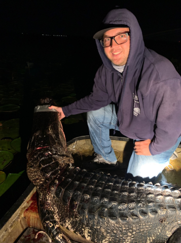 A Man Alongside Alligator